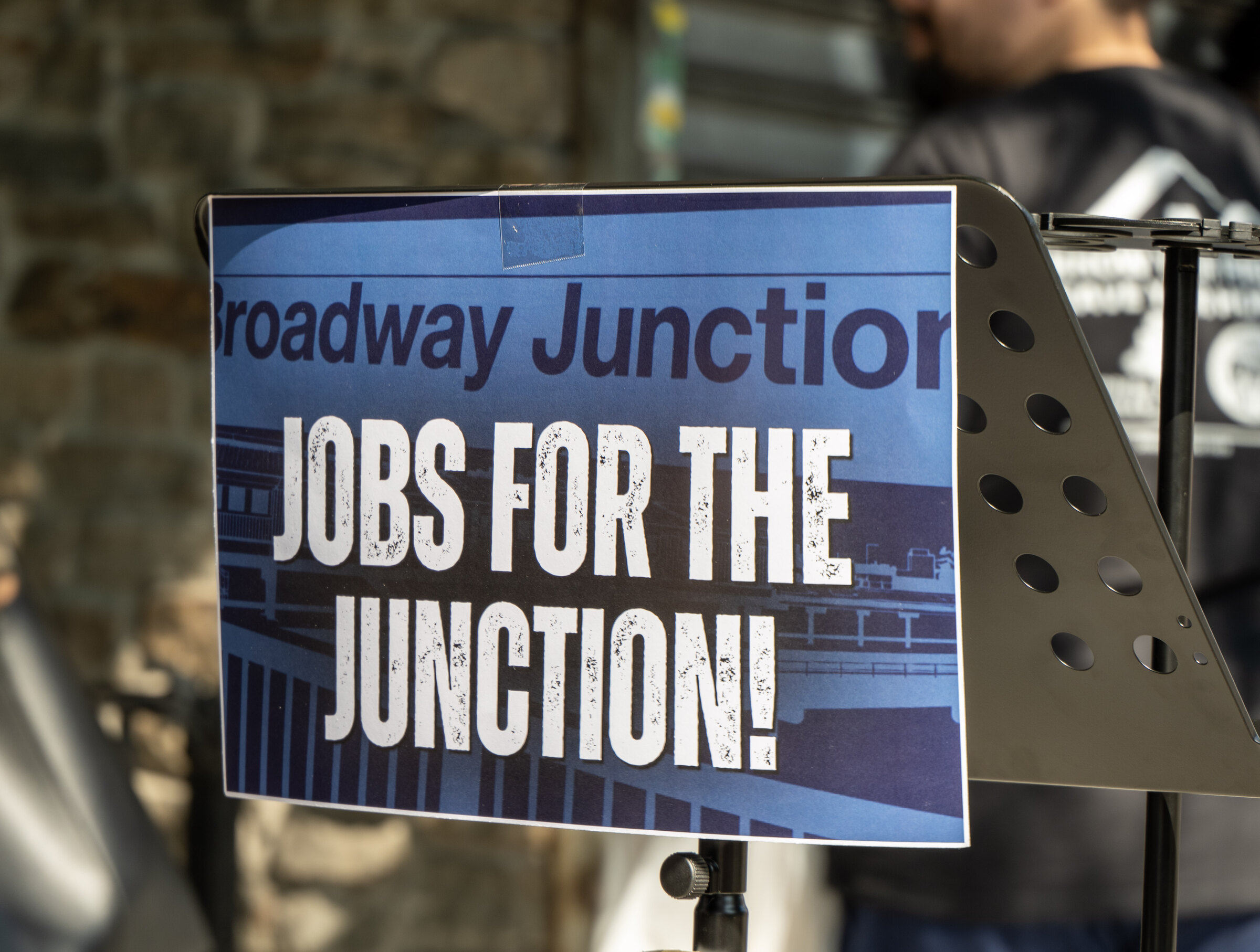 A Jobs for the Junction sign displayed at the Broadway Junction local hiring rally