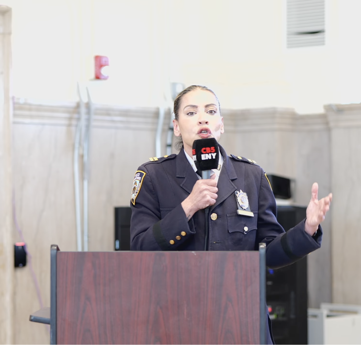 Captain Lori Perez speaking at a Community Board 5 meeting in East New York